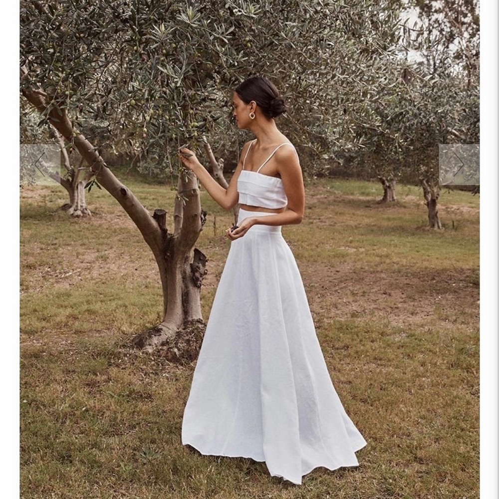 Brand new-only tried on. Brand: DISSH.Size two top, size 4 skirt.Colour: white